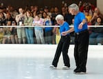 Tally Leonard, left and Jerry Leonard, right, hold hands as they perform their final skate. The pair have skated together at Lloyd Center for nearly six decades.