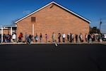 People wait in line to vote outside a polling station at the Dryland United Church of Christ in Nazareth, Pa., on Tuesday.