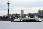 FILE - A Washington State ferry travels into Elliott Bay in Seattle on Saturday, Feb. 17, 2024.