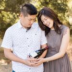 Dave and Lois Cho of CHO Wines pose with a bottle of red wine from their winery.