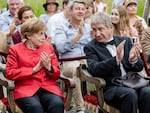 In a scene from the TV series, Miss Merkel, played by Katharina Thalbach, and her husband, played by Joachim Sauer, sit in the audience watching a play.