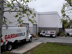 Armored trucks are parked outside the GardaWorld facility in the Sylmar section of Los Angeles on Thursday, April 4, 2024.