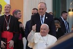 Pope Francis greets faithful during a visit to the French island of Corsica on Dec. 15. President Biden has awarded Pope Francis the Presidential Medal of Freedom with distinction.