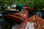 A fisherman ties boats in preparation for the forecasted arrival of Hurricane Melissa in Old Harbour, Jamaica, Monday, Oct. 27, 2025.