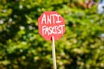 A protest sign held by a demonstrator at a rally at the Atlanta Civic Center on Oct. 18 in Atlanta.