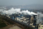Smoke and steam rise from a coal processing plant in Hejin in central China's Shanxi Province on Nov. 28, 2019. A United Nation-backed panel plans to release a highly anticipated scientific report on Monday, April 4, 2022, on international efforts to curb climate change before global temperatures reach dangerous levels.