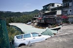 New Taipei City: A vehicle in a collapsed road following an earthquake