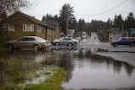 A parking lot floods during a king tide in Nehalem, Oregon.