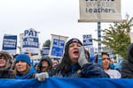 Despite the pouring rain, hundreds of people attended Portland Association of Teachers rally held at Roosevelt High School in Portland, Ore., Nov. 1, 2023. 