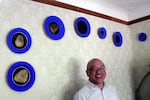 Artist Horatio Law, with samples from his series, "China Wall". The plates, bearing photographic images, were inspired by Law's inquiry into the history of Chinese mine workers in Oregon.