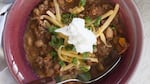 In this easy chili, use up cooked meat you have on hand. Jill Lightner’s suggestions include rotisserie chicken; sliced, chopped ham; leftover roast turkey; leftover Porterhouse steak cut into bits and frozen; or smoked turkey leg (you used half in a sandwich and stashed the rest in the freezer for just this opportunity).