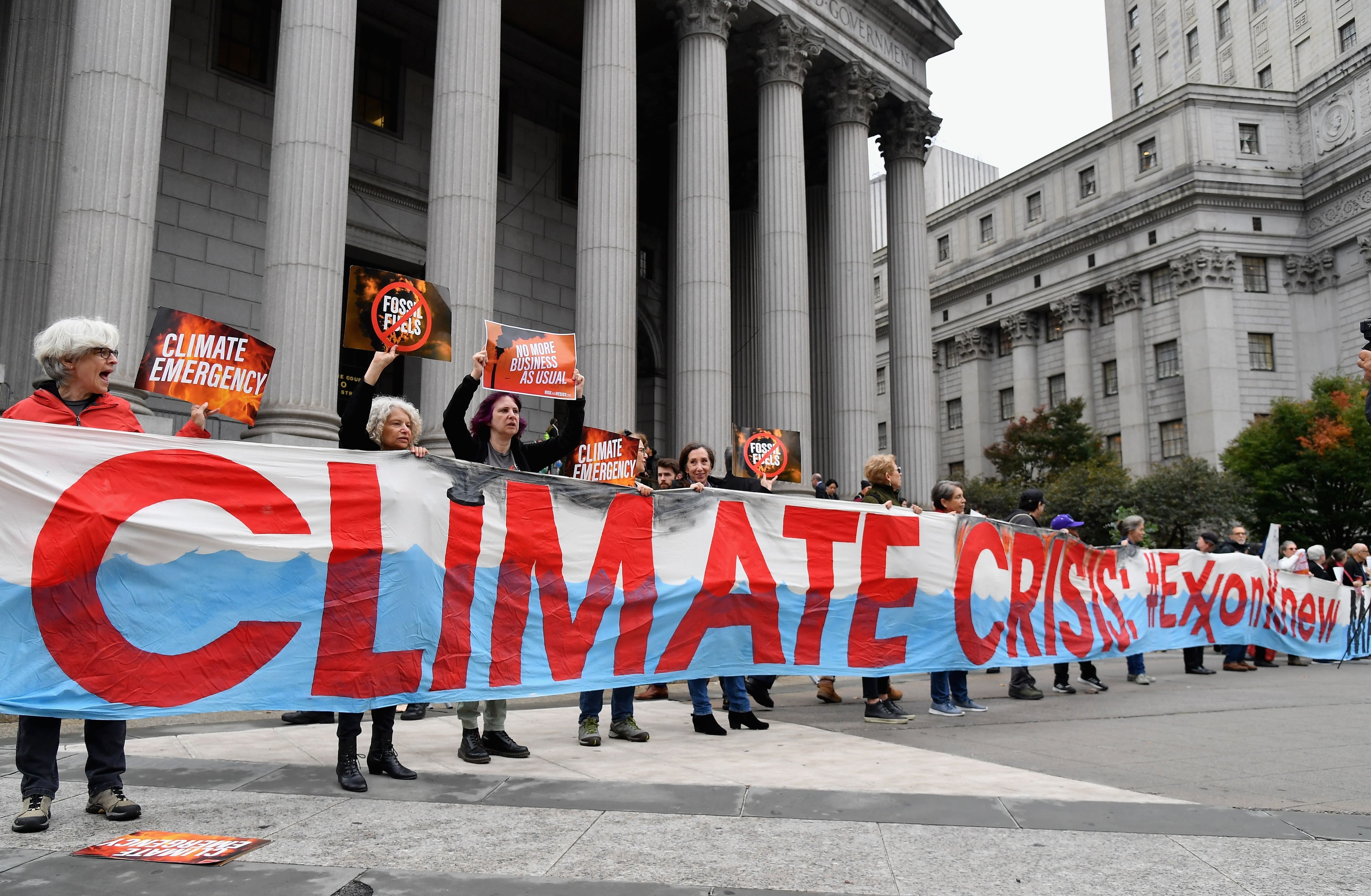 Climate activists protest on the first day of an ExxonMobil trial outside the New York State Supreme Court building in 2019 in New York City. Justice Barry Ostrager of the New York State Supreme Court ultimately found that the New York Attorney General's Office failed to prove that ExxonMobil broke the law.