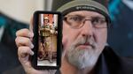 Matthew Butler, who spent 27 years in the Army, holds a 2014 photograph of himself during his last deployment in Kabul Afghanistan, on Wednesday, March 30, 2022, in Sandy, Utah. Butler is now one of the military veterans in several U.S. states who are helping convince conservative lawmakers to take cautious steps toward allowing the therapeutic use of hallucinogenic mushrooms and other psychedelic drugs. The therapeutic used of so-called magic mushrooms and other psychedelic drugs is making inroads in several U.S. states, including some with conservative leaders, as new research points to their therapeutic value and military veterans who have used them to treat post-traumatic stress disorder become advocates. (AP Photo/Rick Bowmer)