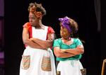 Playing the roles of two house slaves, Andrea Vernae and Jocelyn Seid enter the stage with protest signs that say "I don't know what a slave sounded like and neither do you." Throughout the course of the play, their language switches from modern day vernacular when they're alone to the romanticized vernacular of slaves when they're around white masters.