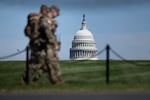 The U.S. Capitol is seen as members of the National Guard patrol the National Mall in Washington, D.C. earlier this month.