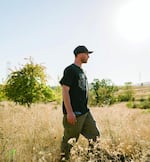 Sean Kelly roams among wild pear and apple trees on the Eugene-Goshen border in Lane County, public land where he picks fruit for commercial cidermaking.