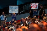 Protesters in the crowd interrupt as Portland Mayor Keith Wilson speaks during the annual Portland Metro Chamber meeting, amid discussions of renovating the Moda Center with public money, at the Moda Center in Portland, Ore., on June 24, 2026.