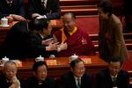 Delegates talk to Gyaltsen Norbu, the Chinese government-appointed 11th Panchen Lama during the closing ceremony of the Chinese People's Political Consultative Conference (CPPCC), in Beijing, Wednesday, March 11, 2026.