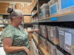 Shasta County Clerk Cathy Darling Allen looks at bins containing election supplies for all the precincts.