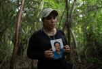 Yadira Gonzalez, 38, poses with a picture of her missing brother, Juan Gonzalez.