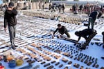 The Popular Mobilization Forces display weapons seized from ISIS in Salahuddin province, north of Baghdad, Iraq, in 2023.