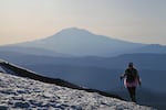 A woman in a pink tutu climbs Mount St. Helens on Mother's Day, following a tradition started by Kathy Phibbs.