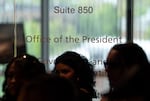 The door to PSU President Ann Cudd’s office in the Richard & Maurine Neuberger Center remains locked as Portland State University students and high school students from around the area, who walked out of school to join the demonstration, chant and rally in the hallway on April 30, 2026 in Portland, Ore.
