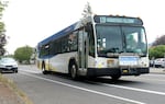 A TriMet bus serving Line 19 travels along Southeast Duke Street. Line 19 is one route being impacted by TriMet’s reductions of transit service that starts on Aug. 23.