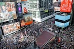 Thousands of protesters fill Times Square during a "No Kings" protest.