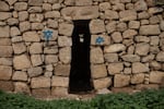 Stars of David are spray-painted on an old structure in the abandoned Palestinian village of Zanuta in the occupied West Bank on Feb. 19.