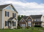 Some baby boomers would like to downsize from their large homes, but say it doesn't make financial sense. Single-family homes in Dumfries, Va., are seen here last year.