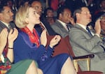 United States First Lady Hillary Rodham Clinton, left, and Vice President Al Gore applaud during a variety musical performance of "Sophiatown" by members of the Market Theatre Company on Monday, May 9, 1994 in Johannesburg. Rev. Jesse Jackson is seated behind Gore.