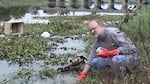 In 2002, the Basel Action Network's Jim Puckett tests the water quality near Guiyu, China, where residents cooked electronics to extract precious metals and dumped the leftovers in a nearby river.