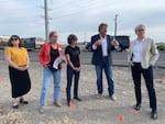Gov. Tina Kotek tours Boardman with local organization Oregon Rural Action on May 3. The group stops near the Port of Morrow, where a recent leak allowed thousands of gallons of wastewater to contaminate the site.