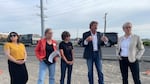 Gov. Tina Kotek tours Boardman with local organization Oregon Rural Action on May 3. The group stops near the Port of Morrow, where a recent leak allowed thousands of gallons of wastewater to contaminate the site.