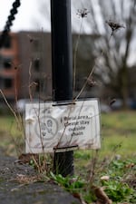 A sign reminds visitors of the burial ground at Block 14.