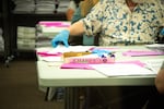 On Saturday, May 22, 2022, election workers process Clackamas County ballots that are unreadable by machines due to misprinted barcodes.