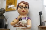 A sculpture created by Scott Foster depicts a waitress holding a plate of doughnuts from Pip's Original, seen in his studio on Nov. 11, 2021.