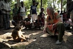 Dr. Lisa Jones-Engel, a primate scientist, and a rhesus macaque in Bangladesh in 2015, not long before she stopped working at the UW's National Primate Research Center.