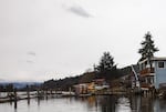 The Wheeler Marina used to flood a few times a year, until the shop owner raised the building four feet. Today, water laps at the retaining wall.