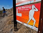 A hiker finishes her hike early to beat high temperatures on July 10, 2023, in Phoenix.