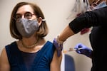 Governor Kate Brown receives a booster shot of the Moderna Covid-19 vaccine at Salem Health Edgewater Clinic in Salem, Ore. on Tuesday, Oct. 26, 2021.