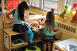 Preschoolers working together on a puzzle (file photo).