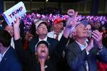 Supporters watch returns at a campaign election night watch party for Donald Trump at the Palm Beach Convention Center in Florida.