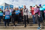 FILE - Aimee Kotek Wilson, left, and her wife, Oregon Gov.-elect Tina Kotek, arrive at a press conference on Thursday, Nov. 10, 2022 at the Salmon Street Springs in Portland.