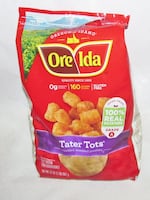 An unopened bag of Ore Ida brand tater tots.