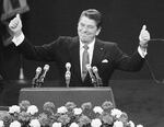 FILE - In this July 17, 1980, file photo, Republican presidential candidate Ronald Reagan stands before a cheering Republican National Convention in Detroit's Joe Louis Arena.
