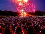 Spectators watch as fireworks erupt over the Washington Monument on July 4, 2022, in Washington, D.C.