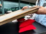 Girls balance cookie sheets with bean bags to get a 20 degree slope.