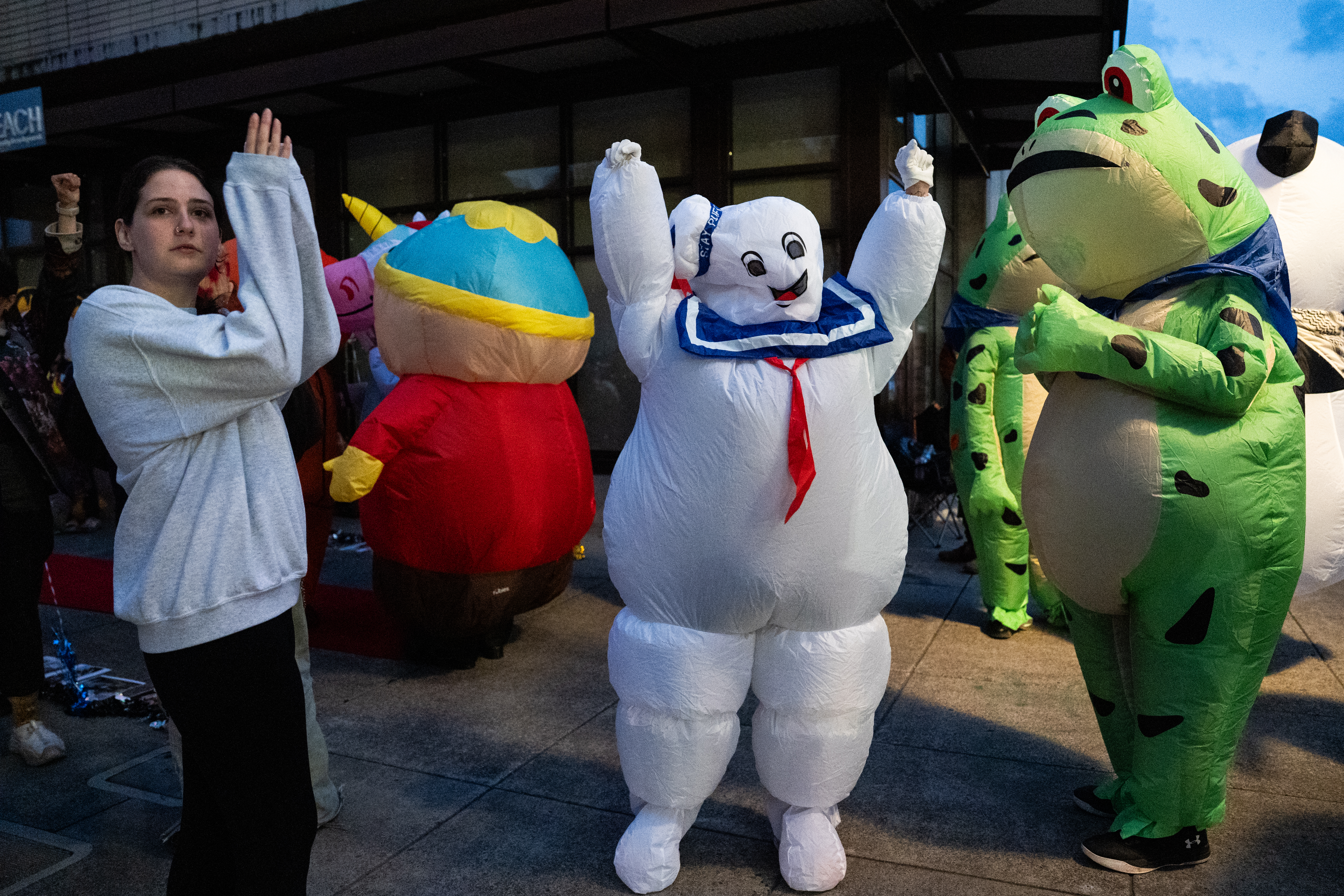 Protesters cheer at honking cars in front of the U.S. Immigration and Customs Enforcement.